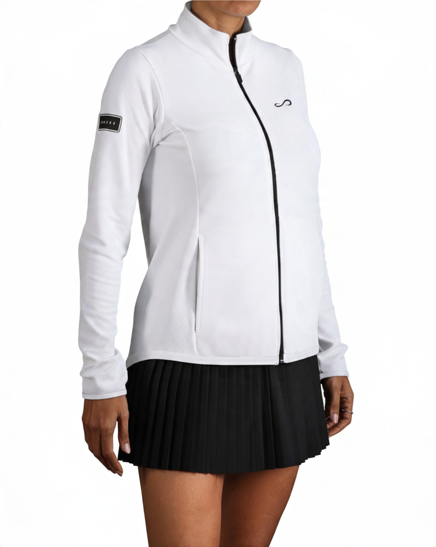 Chaqueta deportiva Endless blanca de mujer con cremallera, cuello alto y tejido elástico transpirable.