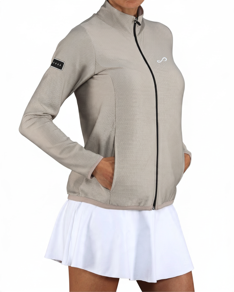 Chaqueta deportiva Endless MX Lithe color beige con cremallera, cuello alto y bolsillos, ideal para tenis y padel.