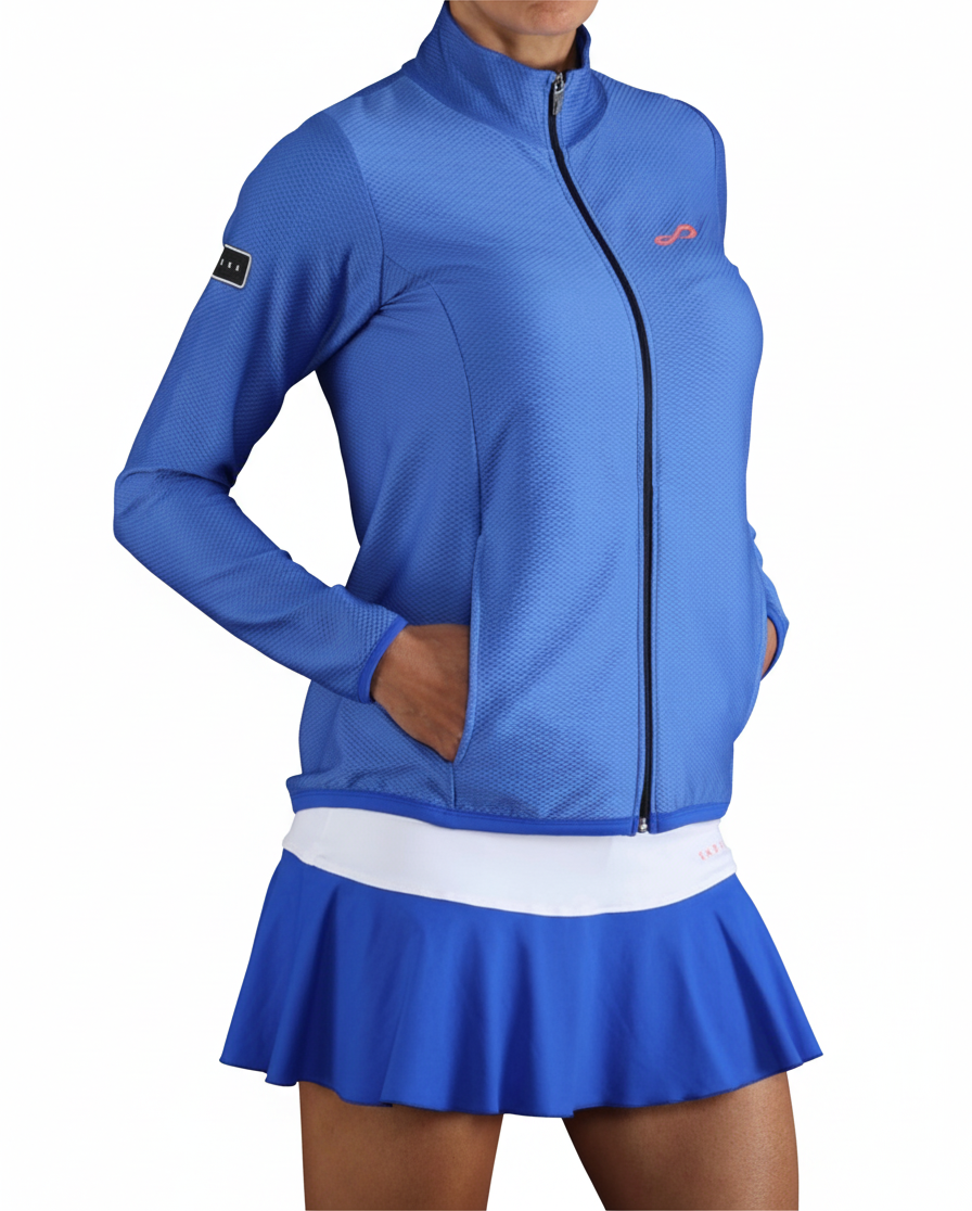 Chaqueta deportiva Endless MX Lithe azul de mujer con cremallera, cuello alto y bolsillos, ideal para tenis y pádel.